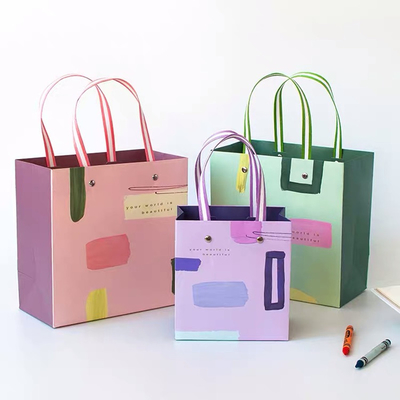 Les sacs 40g non tissés de Noël CMYK 32x11x25cm sont écologiques