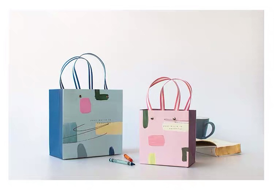 Les sacs 40g non tissés de Noël CMYK 32x11x25cm sont écologiques
